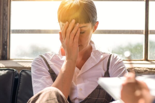 Stressed woman during therapy session indoors How Leaders Can Build Trust After Making a Major Mistake